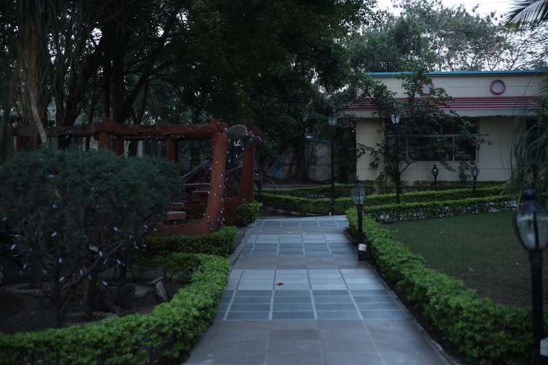 Resort garden pathway and landscaping at Fun N Food Indore
